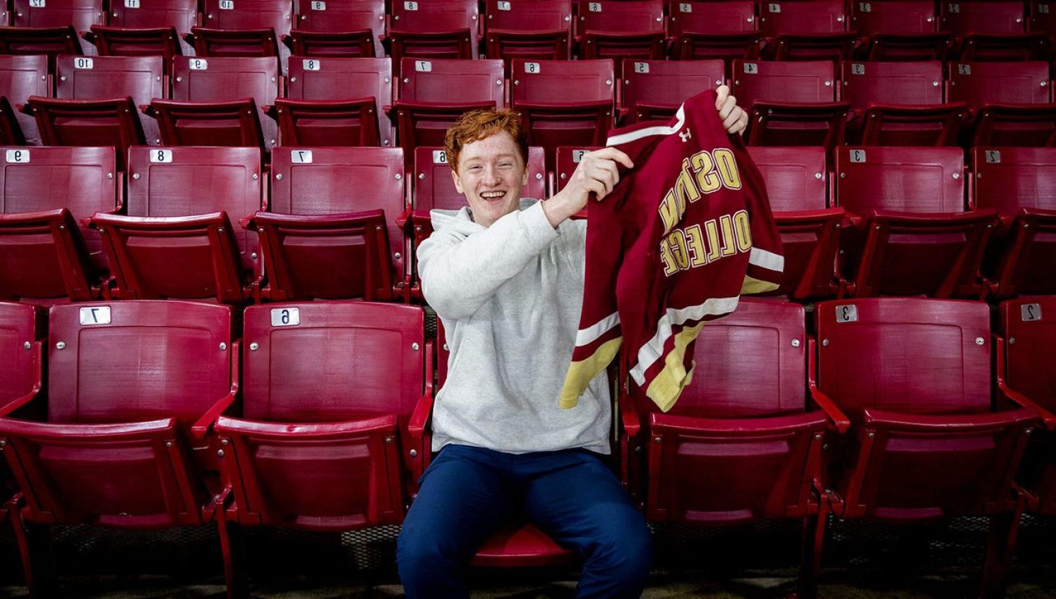 Danny Gillis holding a BC jersey